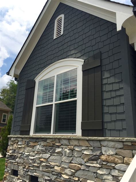 metal roof grey house|grey houses with black shutters.